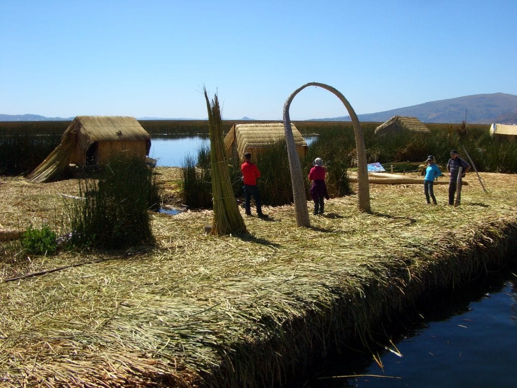 One of many of the floating Uros Islands, with an arch woven of the same reeds used to make the island.
